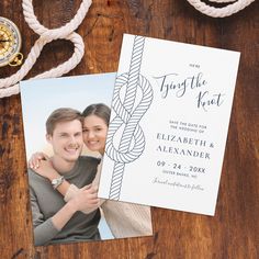 an image of a wedding save the date card on a table with rope and compass