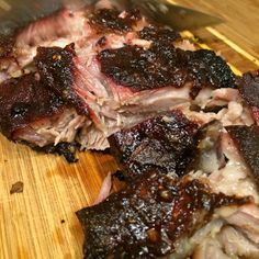 the meat is being cooked on the cutting board