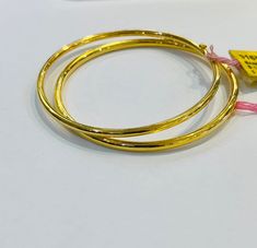 "Pure 22ct gold bangle 916 gold Yellow Gold by Mbrilliance Purity : 916 GOLD purity  Appx Weight : 6.40 - 7.00 grams  Colour : YELLOW GOLD Hallmark : Hallmarked 916 (916 Stamp) Design :  evergreen plain round bangle  Size: Appx diameter 2\" - 2.3\" Thickness Appx 2mm Price stated is for 1 piece of bangle.  Item is sold on per piece basis. Approximate Weight stated is for reference.  Authentic 916 gold by MBRILLIANCE® FAQs Q: Is it real gold? A: yes it's real authentic genuine 916 gold  Q: can pa 22k Gold Round Bangle, 22k Yellow Gold Bracelet, Helix Ring, Bali Earrings, Gold Nose Rings, Colour Yellow, Gold Bangle, Stamp Design, 22k Gold