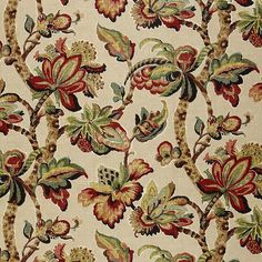 an upholstered fabric with flowers and leaves on it