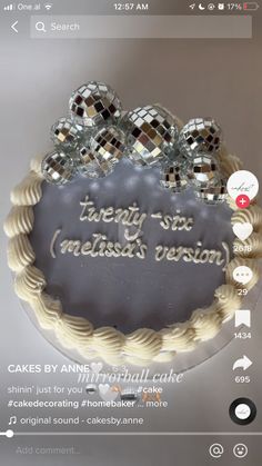 there is a cake that has been decorated with disco balls and the words twenty six