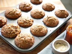 freshly baked muffins on a baking tray next to a jar of ketchup