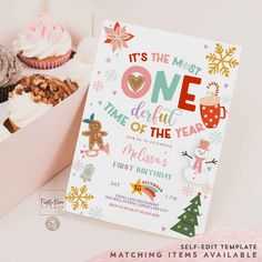 an open box filled with cupcakes and other treats next to a card that says it's the most one