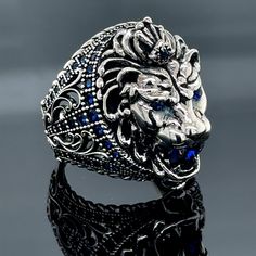 Silver Leon Head Ring, Sapphire Stone Lion Ring, Handmade Wild Lion Ring, Large Leon Animal Ring, 925k Sterling Silver Ring , Father Day ★Item Details * Gender : Male / Female * Material : 925K Sterling Silver * Total weight : 18 Grams * Gemstone : Sapphire  Stone ✔ Ready to Ship in 1-2 Business Days .. ✔ Shipped to the Worldwide 1-5 business days with free shipping... ✔ The product will be sent to you with a handmade wooden box to avoid any damage during shipping... ✔ Visit our store, browse ot Lion Ring Women, Emerald Stone Rings, Lion Jewelry, Stone Lion, Wild Lion, Mystic Topaz Ring, Animal Ring, Lion Ring, Ring Sapphire