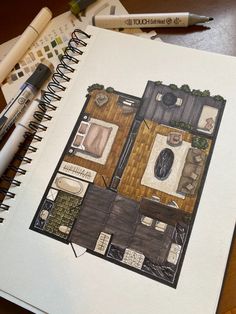 a drawing of a house with furniture and accessories on the table next to markers, pens and pencils