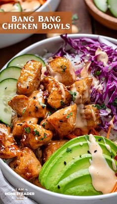 a bowl filled with chicken and coleslaw next to cucumber, avocado