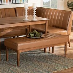 a dining room table and bench with apples on it