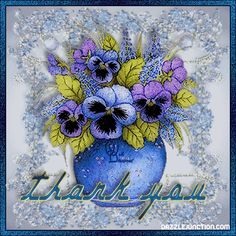 a blue vase filled with purple pansies on top of a white table next to a thank you sign