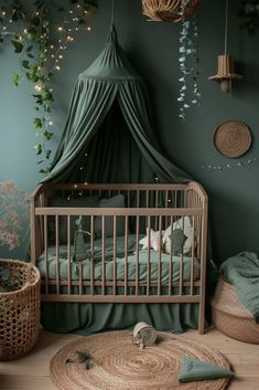 a baby's room with a crib and green walls