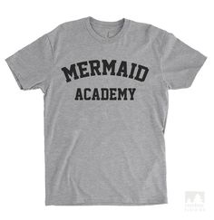 Sale: Buy Any 3 Get 4th Free - Add 4 items to your cart and the discount will apply automatically at checkout. Buy 8 and get 2 free / Buy 12 and get 3 free, and so on!Our Mermaid Academy design is available in various styles - Unisex Short Sleeve Tees (Crew Neck and V-Neck), Unisex Long Sleeve Tee, Ladies' Racerback Tank Top as well as Sweatshirt and Hoodie.Sizing Detail: Our Racerback Tank Tops are slim fitting and run small for some people. Unisex tees are closer to men's sizing so for guys th Shark T Shirt, Cheap Shirts, Cheap T Shirts, Text Style, T Shirt Diy, Tank Top Hoodie, Direct To Garment Printer, T Shirt Print, Personalized T Shirts