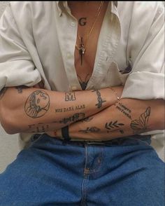 a person with tattoos on their arms