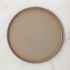 a brown plate sitting on top of a white counter