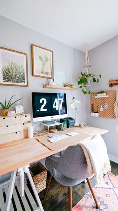 a desk with a computer on it and the words small home office makeover