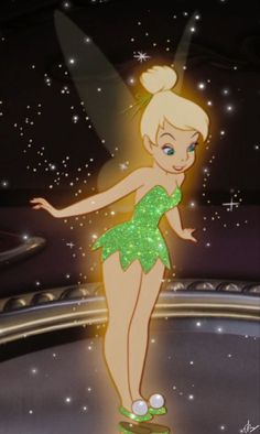 tinkerbell from the disney movie is standing on a stage with her arms outstretched