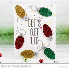 a handmade christmas card with glitter lights and the words let's get lit