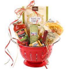 a red colander filled with condiments and snacks