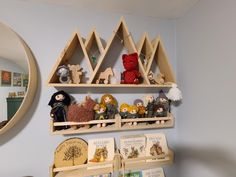 shelves with toys and books on them in a child's room