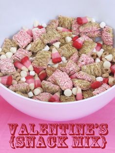 valentine's snack mix in a white bowl on a pink background with the words valentine's snack mix