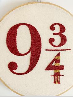 an embroidered hoop with the number nine on it