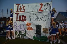 some cheerleaders are holding up a sign that says it's 2 take the days