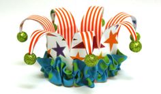 an origami christmas hat with stars and candy canes