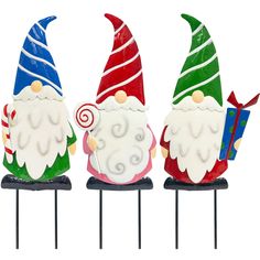 three colorful gnomes sitting on top of each other