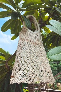 Our Omaja bag is the epitome of a perfect island life beach bag. Our take on the classic fisherman style, the Omaja has been handwoven by our artisan friends in Turkey, and was designed as a multi-purpose bag; from days at the beach, to running errands around town. Eco-friendly Macrame Straw Bag For Vacation, Eco-friendly Macrame Tote Bag, Bohemian White Natural Fiber Bag, White Bohemian Natural Fiber Bag, White Macrame Vacation Bag, Eco-friendly Macrame Beach Bag, Natural Macrame Beach Bag, Natural Macrame Tote Beach Bag, Natural Macrame Beach Bag Tote