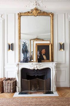 a living room with a fireplace and mirror