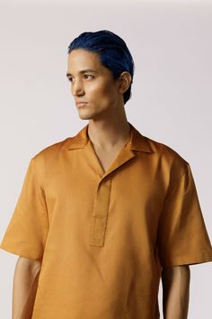 Mustard glaze cotton casual shirt, designed with half sleeves and featuring a half-placket detail. Fit: Comfort fitColor: MustardFabric: Glaze cotton Collared Polo Shirt With Placket For Summer, Modern Collared Camp Shirt With Relaxed Fit, Collared Polo Shirt For Summer, Modern Relaxed Fit Collared Camp Shirt, Summer Short Sleeve Polo Shirt With Placket, Summer Polo Shirt With Short Sleeves, Summer Short Sleeve Polo Shirt, Collared Short Sleeve Cotton Shirt With Placket, Collared Cotton Short Sleeve Shirt With Placket