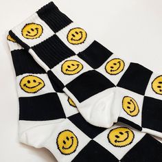 Combined cotton, spandex, polyester, polyurethane calf socks. Checkered pattern with alternating yellow smiley faces. One size fits women 7- 11 Fun Yellow Cotton Socks, Trendy Yellow Socks, Trendy Yellow Winter Socks, Smiley Face Clothing, Bath Salt Gift Set, Checkered Socks, Happy Smiley Face, Yellow Smiley Face, Funky Socks