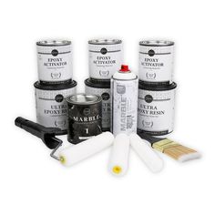 several different types of paint and brushes on a white background