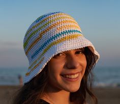 Panarea is a crochet hat with a soft brim. It is an extra-large model created for those who love a large hat that protects from the sun but does not constrict the head. This fisherman's hat features several asymmetrical stripes in yellow, turquoise and acid green on a white base. Each hat is a unique piece. With each sale, this model is re-proposed in a new shade of colors. COMPOSITION Cotton ONE SIZE Hat circumference 23,6 inch /  60 cm  It is suitable for men, women with large heads, women who Crochet Fisherman Hat, Crochet Hat For Women, Fisherman's Hat, Large Hats, Women Hat, Hat Handmade, Hat Summer, Fisherman Hat, Cloche Hat