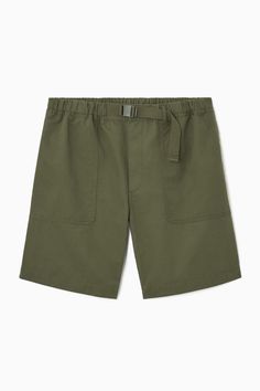 Functional at their core, these utility shorts have been cut from lightweight cotton, to a relaxed fit. Featuring a partially elasticated waistband with an adjustable belt, they are flexible in fit, whist the multi-pocketed design ensures practicality. We suggest pairing them with an oversized T-shirt. Relaxed fitPartially elasticated waist with front fly fasteningGrosgrain beltTwo side slip pockets and two rear welt pockets Shell: 100% Cotton. Pocket lining: 100% Cotton. Excluding trims / Machine wash Inside leg length of size 32R is 21.65cm / Model wears a size 32R Grandad Collar Shirt, Latest Clothes For Men, Oversized Polo, Culotte Shorts, Baseball Tops, Utility Shorts, Denim Cargo Pants, Vest Shirt, Knitted Tshirt