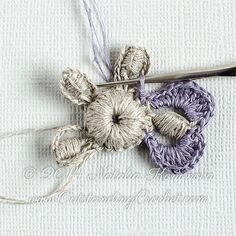 a crochet flower is being worked on