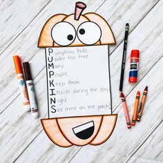 a pumpkin themed writing activity with markers and crayons