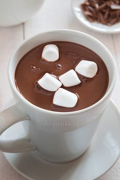 a cup of hot chocolate with marshmallows in it