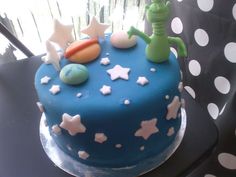 there is a blue cake with stars on it