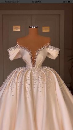 a dress on display in front of a door