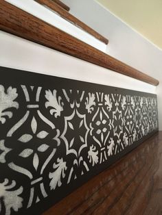 a close up of a wall with decorative designs on it