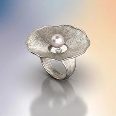 Discover the allure of our Pearl and Diamond Ring, a masterpiece of Italian craftsmanship. This exquisite ring features an 8mm Akoya White Pearl set in your choice of 14k or 18k solid gold—available in yellow, white, or rose gold. Complemented by a 0.1 Ct natural diamond, this ring is a perfect blend of sophistication and timeless beauty. Handcrafted in Vicenza, Italy, this ring embodies the finest traditions of Italian jewelry making. Its organic design, inspired by nature, adds a unique touch Refined White Gold Jewelry With Center Stone, Refined Silver Solitaire Jewelry, Elegant 14k Gold Solitaire Flower Ring, Elegant Solitaire Jewelry In 14k White Gold, Modern 14k Gold Pearl Ring For Wedding, Elegant Solitaire Flower Ring In 14k Gold, Elegant Yellow Gold Solitaire Flower Ring, Elegant 14k White Gold Solitaire Jewelry, Elegant Solitaire Flower Ring For Wedding