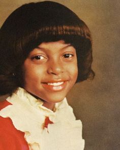 an old photo of a young woman in red and white