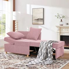 a living room with a pink couch and rug