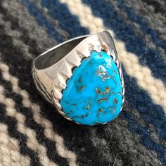 "This is a rare, stunning gem quality turquoise ring by master silversmith Johnny Pablo. Working in Albuquerque in the 1950s to 1970s, Pablo was a Navajo jeweler who, according to a lead authority on Native American jewelry, was considered a \"master of his art\" and especially \"known to select high grade, natural turquoise.\" Another authority concurs that Pablo created \"exquisite pieces of jewelry\" using the \"finest natural turquoise,\" and yet another expert notes that Pablo was \"known f Untreated Round Turquoise Collectible Ring, Western Style Ring With Large Stone For Gift, Collectible Untreated Blue Turquoise Ring, Artisan Turquoise Collectible Rings, Vintage Oval Turquoise Ring Hallmarked, Southwestern Polished Turquoise Ring, Southwestern Style Polished Turquoise Ring, Untreated Blue Turquoise Western Ring, Classic Turquoise Rings Collectible