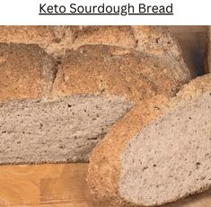 a loaf of keto sourdough bread sitting on top of a wooden table