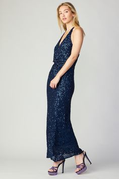 This halter dress is covered in thousands of dark blue sequins that flash with light as you move. It's got a figure-tracing silhouette that ties at the back neckline and features twist detailing at the front. •Halter neckline with tie •Twist front •Allover sequin embellishment •Hidden zipper at back DIMENSIONS •Standard: 50.5" L item number 2390020 95%POLY 5%SPAN Hand wash cold Blue Halter Dress For Gala, Blue Sequin Halter Neck Dress, Sequin Halter Dress, Sequin Halter, Sequin Embellishment, Sapphire Blue, Halter Neckline, Twist Front, Item Number