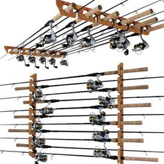 several fishing rods and reels are hanging on a wooden rack with two poles attached to it