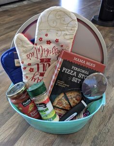 a blue bowl filled with food and condiments on top of a wooden floor