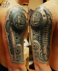 a man's arm with a tattoo on it that looks like a mechanical machine