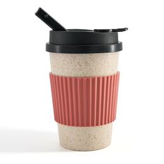 a red and white coffee cup with a black lid