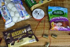 the contents of an assortment of snacks laid out on a wooden table, including eggs, yogurt, and other items